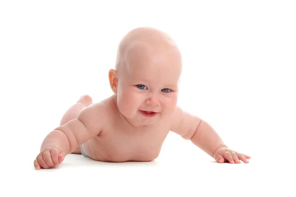 Lycka baby på ett golv — Stockfoto