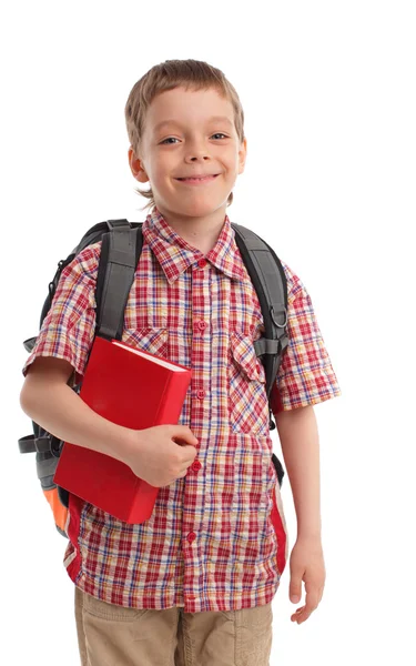 Pojke med ryggsäck och bok — Stockfoto