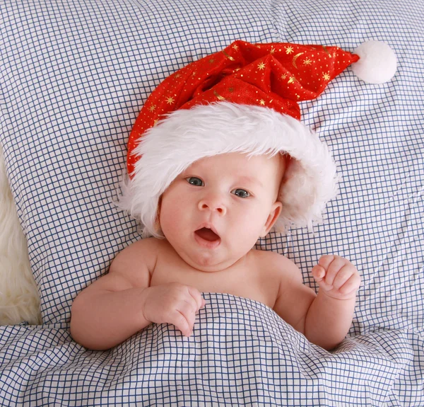 stock image Santa on the bed 2