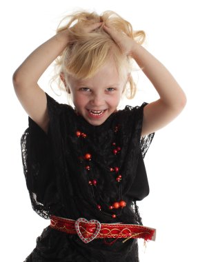 Little girl in costume of a witch clipart