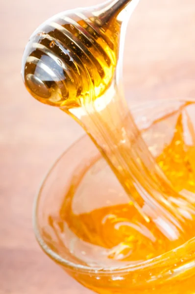 Honey drizzler Royalty Free Stock Images