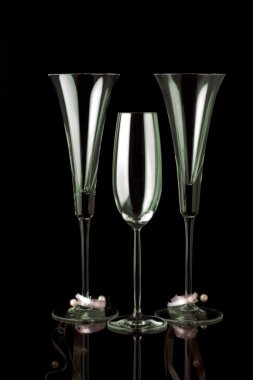 Three champagne glasses on black clipart