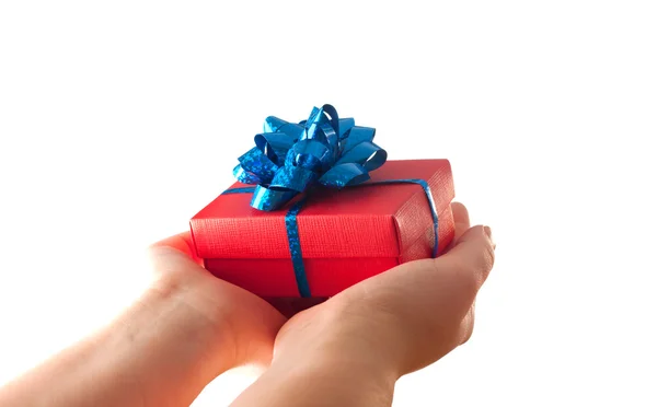 Hands giving a gift — Stock Photo, Image