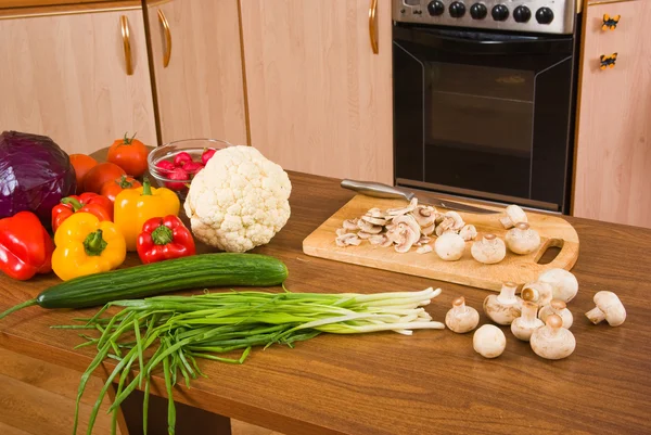 stock image The cut mushrooms and vegetables on a ta