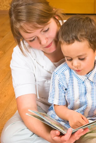 Mum and the son look the book — Stock Photo, Image