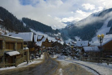 Alpine village in winter clipart