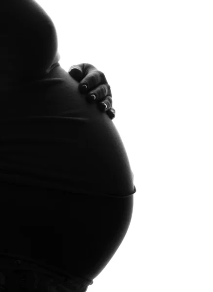La mujer embarazada la silueta —  Fotos de Stock