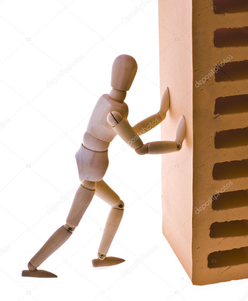Wooden man with a brick