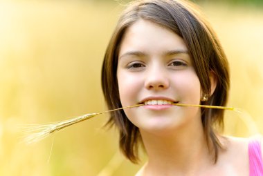 Girl with cone in teeth clipart