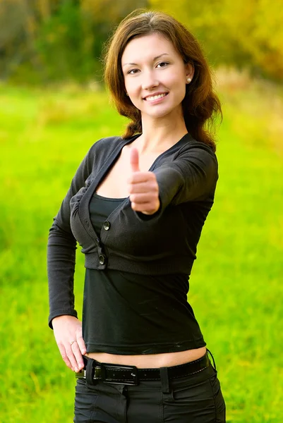 Girl has lifted finger - all well — Stock Photo, Image