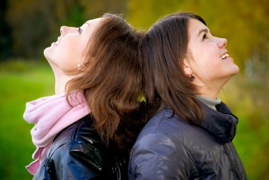 Two girlfriends laugh clipart