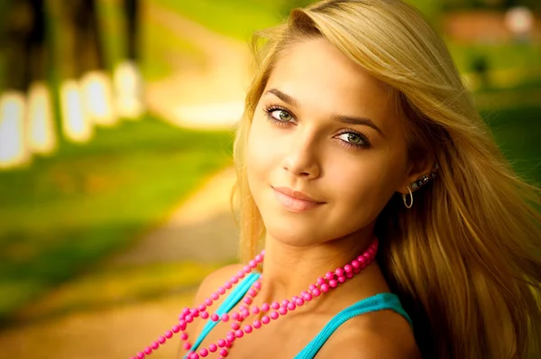 Blonde with beads — Stock Photo, Image