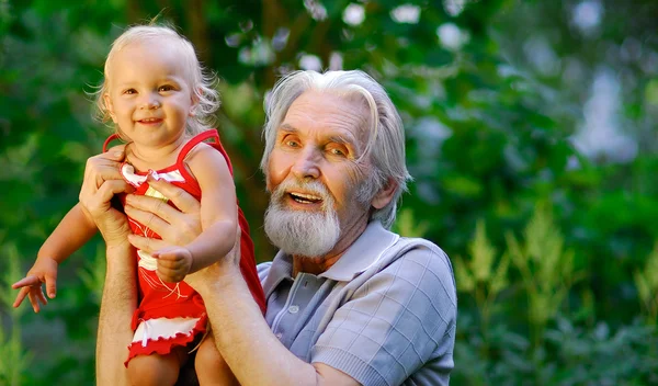 Grandfather and grand daughter — Stock Photo, Image