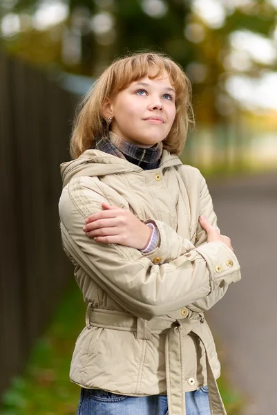 Girl in beige jacket — Stock Photo, Image