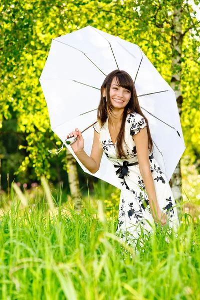 Girl under sun-protection umbrella — Stock Photo, Image