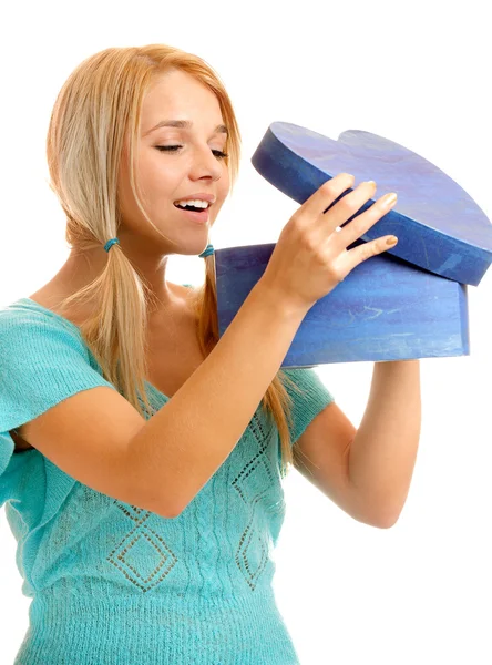 Blonde takes out gift — Stock Photo, Image