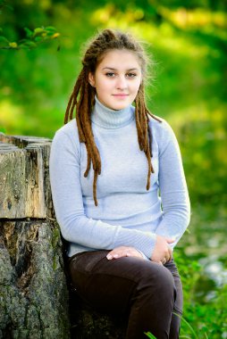 Beautiful girl with dreadlocks clipart