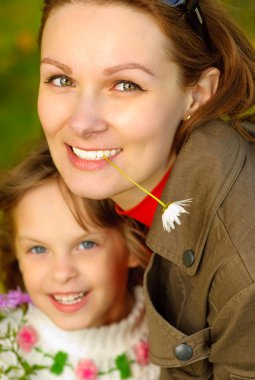 Portrait of mother and daughter clipart