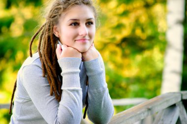 Beautiful girl with dreadlocks clipart