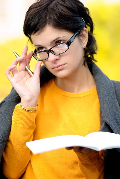 Teacher with pen and writing-book — Stock Photo, Image