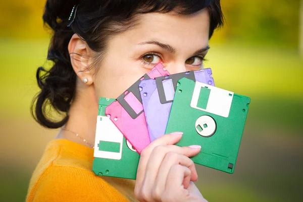 Menina com disquetes — Fotografia de Stock
