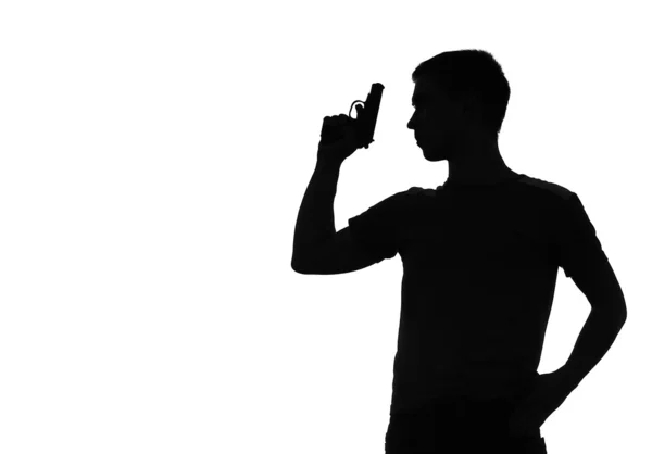 Silhouette of the man with a pistol — Stock Photo, Image