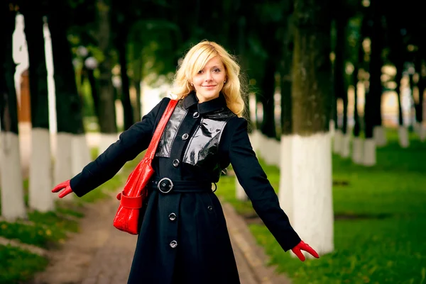 Blonde on footpath in park — Stock Photo, Image