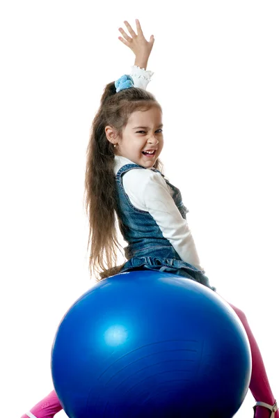 Girl on red sphere — Stock Photo, Image