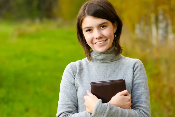 Portrait of girl with book — Stock Photo, Image