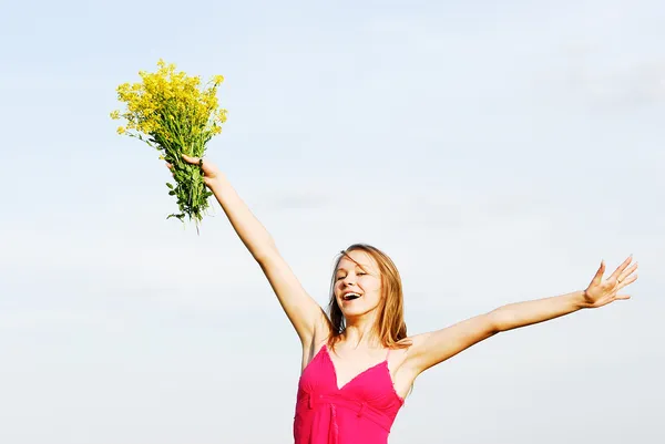 The girl in a red dress with a bouquet — Stock Photo, Image