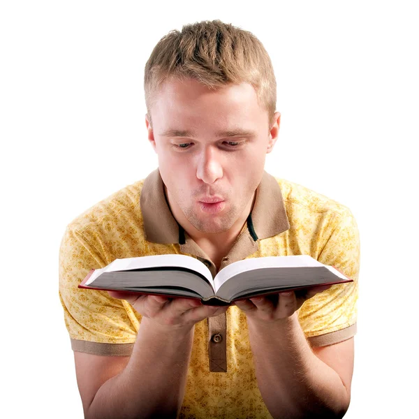 Man blows on opened book — Stock Photo, Image