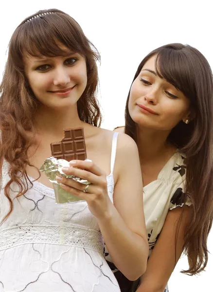 Zwei Mädchen und Schokolade — Stockfoto