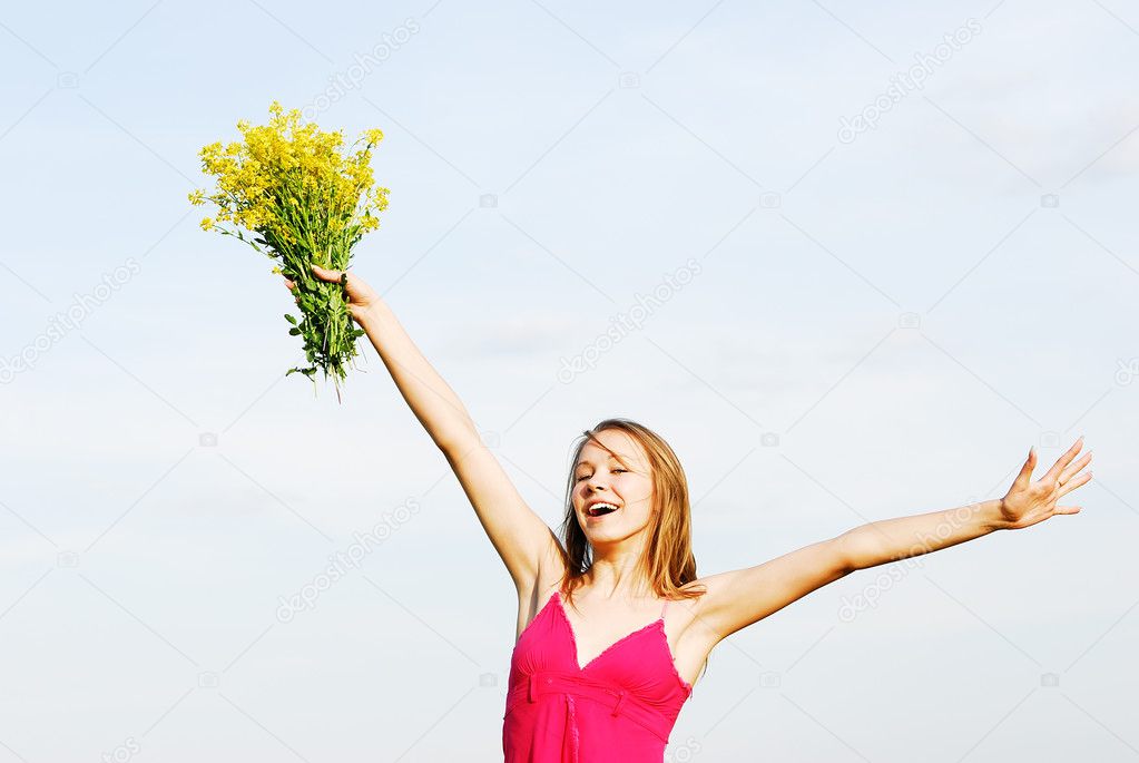 The girl in a red dress with a bouquet
