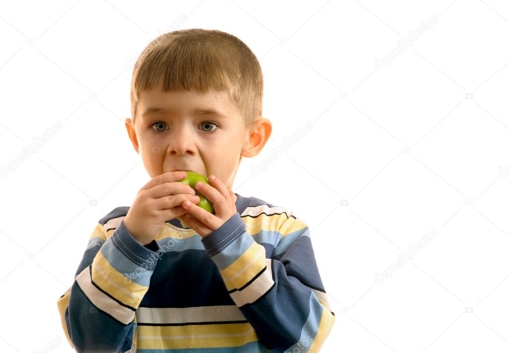 Child eats green apple