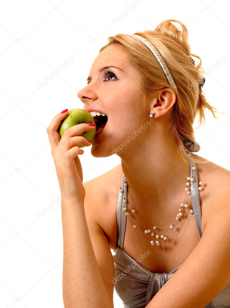 Young woman eats an apple