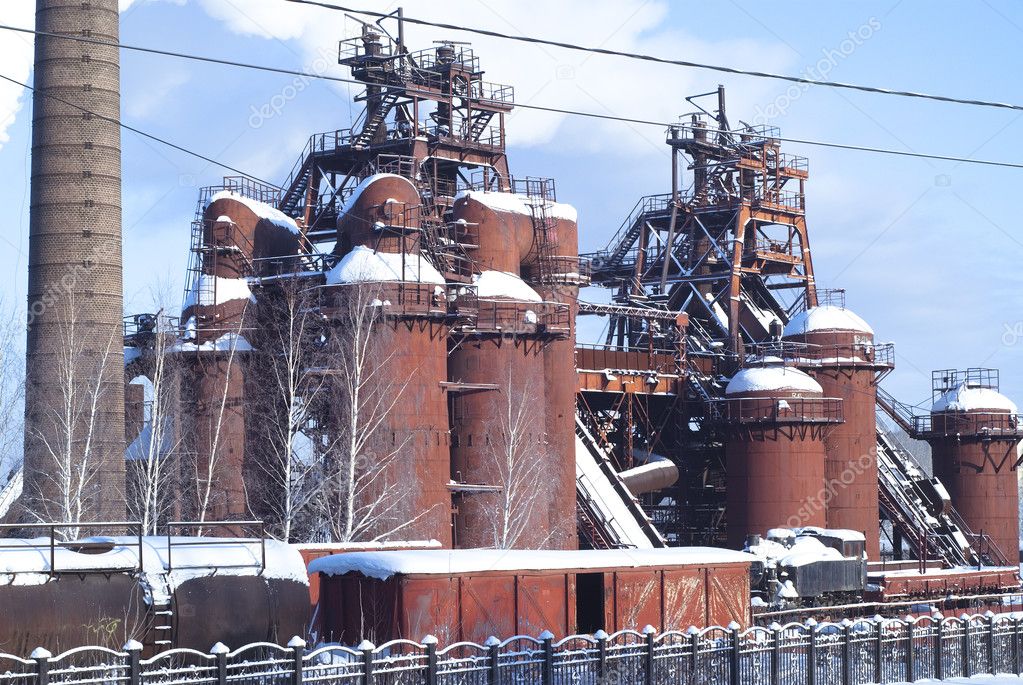 Old factory construction over blue sky Stock Photo by ©Vasilek 1969434