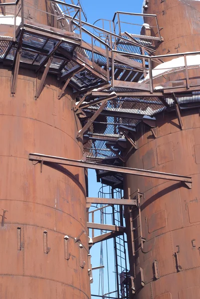 Stock image Old factory construction over blue sky