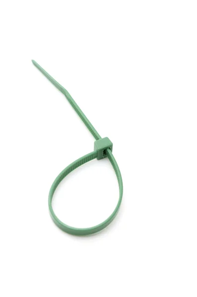 Green nylon cable tie on white — Stock Photo, Image