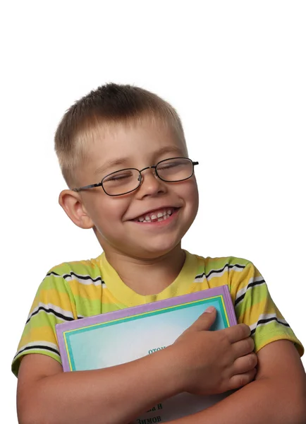 Śmiejąc się chłopiec z książki — Zdjęcie stockowe