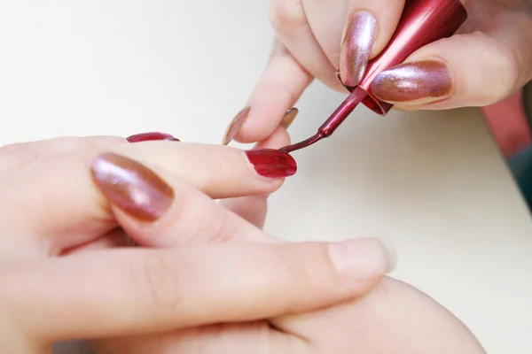 stock image Beautician painting nails