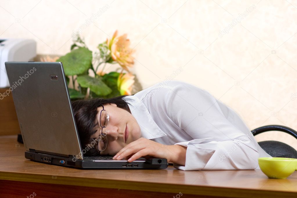 Businesswoman sleeping on the desk