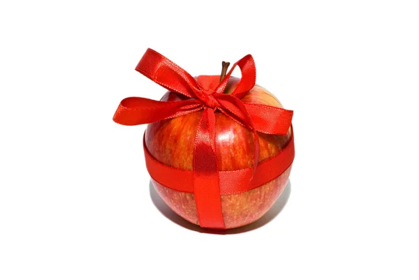 Red apple with a gift bow — Stock Photo, Image