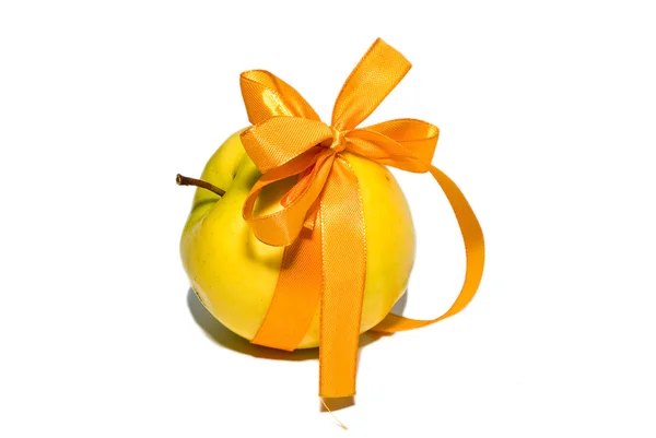 stock image Yellow apple with a gift bow