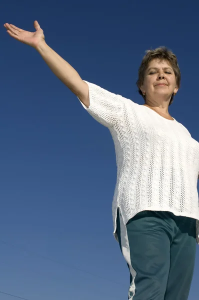 stock image Woman on blue sky