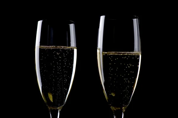 Two glasses champagne on black macro — Stock Photo, Image