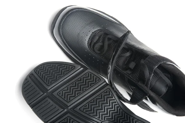 Черные туфли на белом крупным планом — стоковое фото