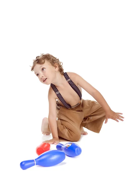 Boy play skittles — Stock Photo, Image