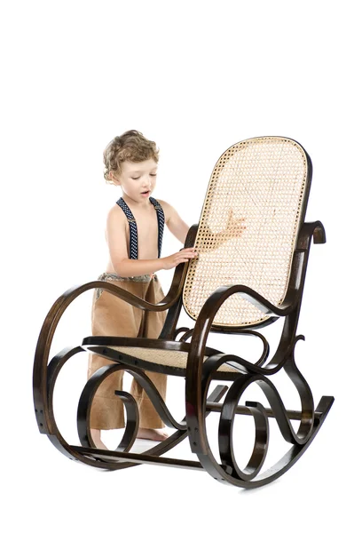 Αγόρι και λικνίζοντας καρέκλα — Φωτογραφία Αρχείου