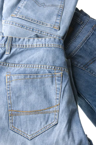 Блакитні джинси на білому крупним планом — стокове фото