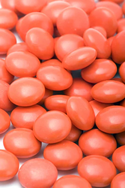 Czerwony tabletki zbliżenie — Zdjęcie stockowe